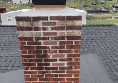 Advanced Fireplace Technicians working on a masonry chimney repair in Fairhope
