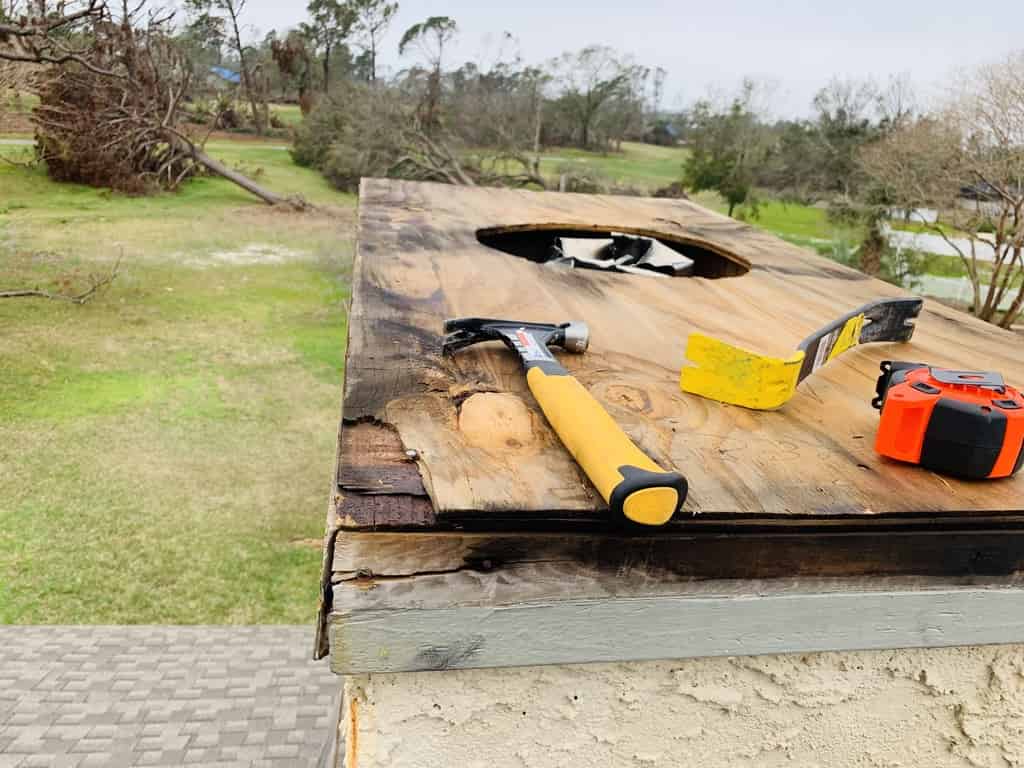 AFT performing a repair on a chimney that was destroyed by weather in Gulfport